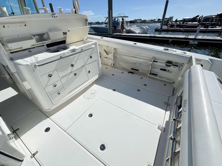 Crews Ship Yacht Photos Pics 2015 Boston Whaler 350 Outrage boat interior with spacious deck and storage compartments.