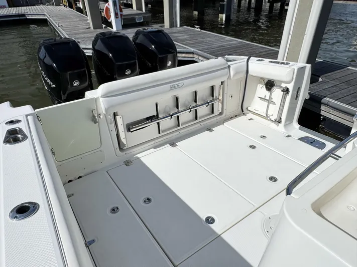 Crews Ship Yacht Photos Pics 2015 Boston Whaler 350 Outrage boat deck with triple outboard engines at dock.