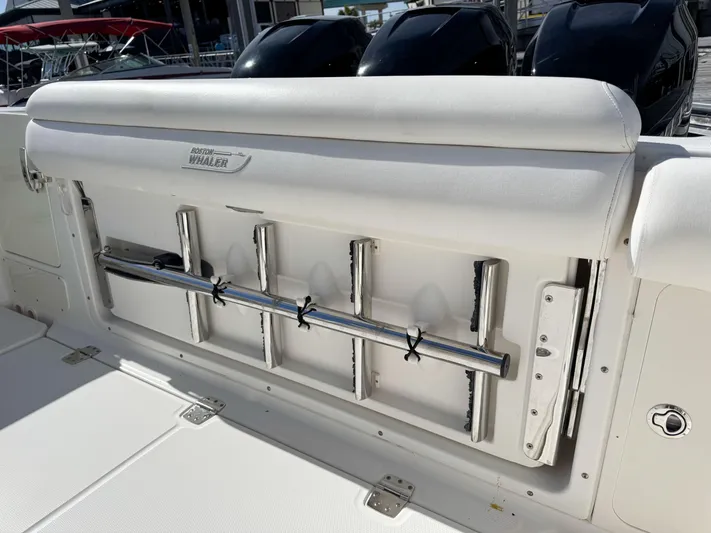 Crews Ship Yacht Photos Pics 2015 Boston Whaler 350 Outrage boat interior with rod holders and seating.