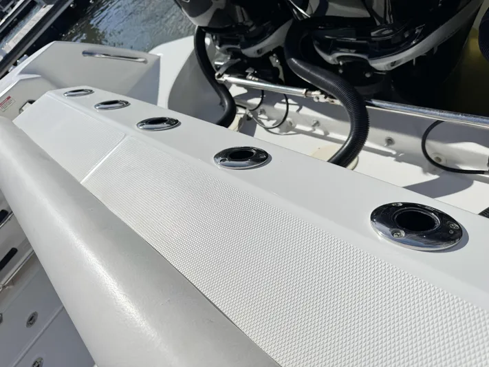 Crews Ship Yacht Photos Pics Boston Whaler 350 Outrage 2015 boat deck with rod holders and engine view.