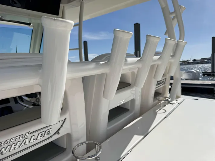 Crews Ship Yacht Photos Pics Boston Whaler 350 Outrage 2015 boat with rod holders and sleek design.