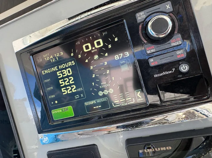 Crews Ship Yacht Photos Pics Dashboard of a 2015 Boston Whaler 350 Outrage showing engine hours and controls.