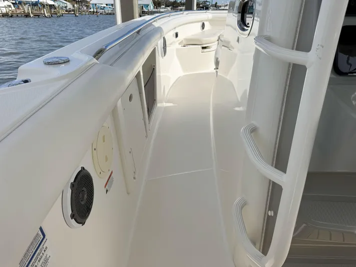 Crews Ship Yacht Photos Pics 2015 Boston Whaler 350 Outrage boat deck with sleek design and waterfront view.