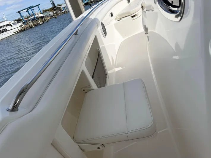 Crews Ship Yacht Photos Pics 2015 Boston Whaler 350 Outrage interior with white seating and sleek design.
