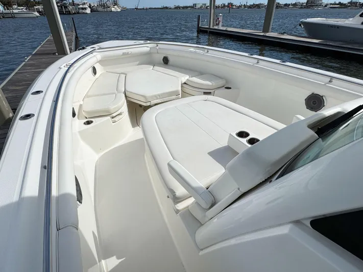 Crews Ship Yacht Photos Pics 2015 Boston Whaler 350 Outrage boat interior with seating and cup holders.