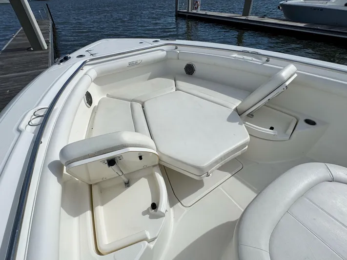 Crews Ship Yacht Photos Pics 2015 Boston Whaler 350 Outrage boat interior with white seating and deck.