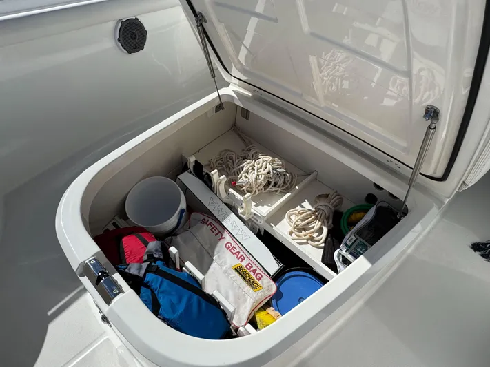 Crews Ship Yacht Photos Pics Open storage compartment on 2015 Boston Whaler 350 Outrage, containing safety gear and ropes.