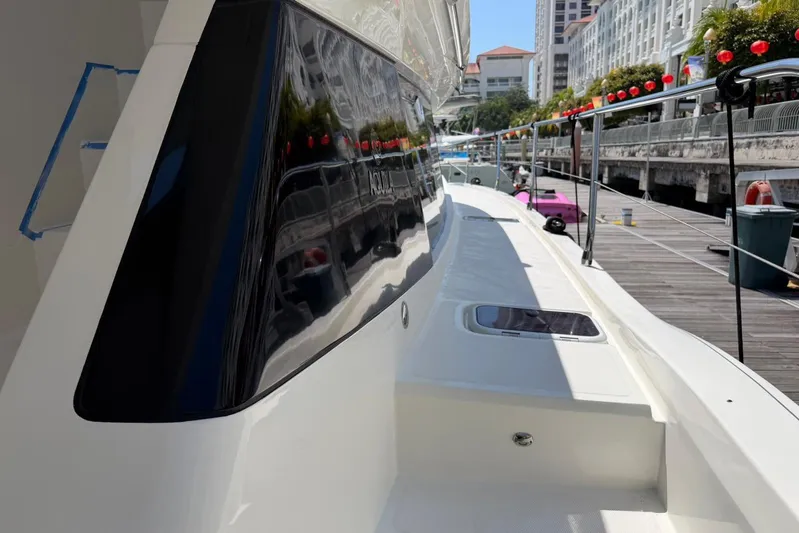 Superlux Yacht Photos Pics 2023 Aquila 42 Yacht docked, showcasing sleek design and modern features.