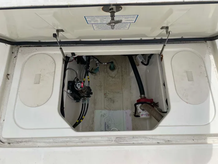 El Gringo Yacht Photos Pics 2004 Hydra-Sports 3300 CC boat storage compartment with open hatch and visible wiring.