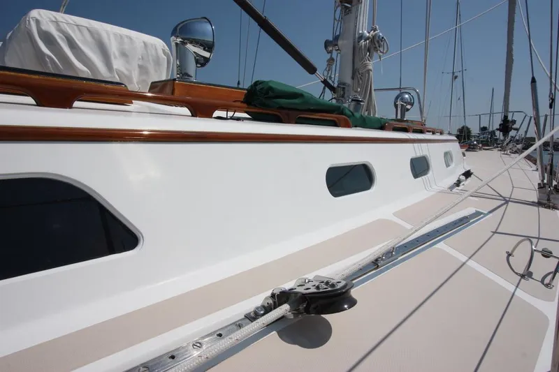 Regulus Yacht Photos Pics Hinckley Sou'wester 51 sailboat deck, 1993 model, featuring sleek design and polished wood accents.