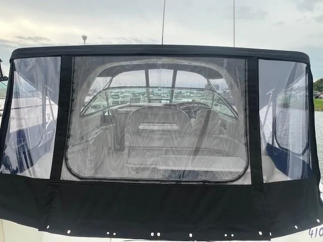  Yacht Photos Pics Sea Ray 410 Sundancer 2000 with black canvas enclosure, docked at marina.