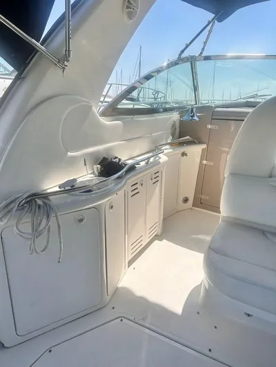  Yacht Photos Pics Interior of a 2000 Sea Ray 410 Sundancer yacht with white seating and cabinetry.