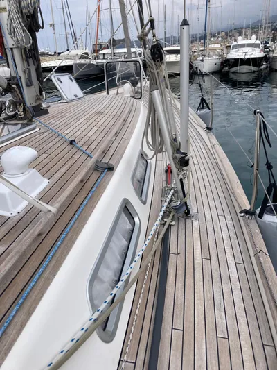 Morgan's Moon Yacht Photos Pics 2008 Hallberg-Rassy 43 sailboat with teak deck, docked in a marina.