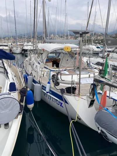 Morgan's Moon Yacht Photos Pics 2008 Hallberg-Rassy 43 yacht docked in a marina, surrounded by other sailboats.