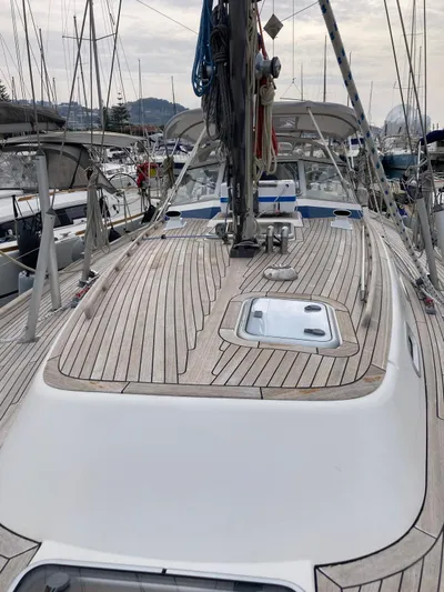 Morgan's Moon Yacht Photos Pics 2008 Hallberg-Rassy 43 sailboat with teak deck, docked in a marina.