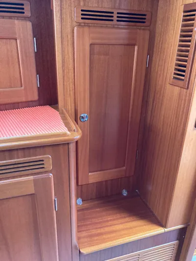 Morgan's Moon Yacht Photos Pics Interior wooden cabinetry of a 2008 Hallberg-Rassy 43 yacht.