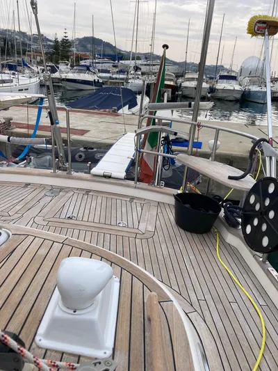 Morgan's Moon Yacht Photos Pics 2008 Hallberg-Rassy 43 sailboat docked in a marina with wooden deck and nautical equipment.