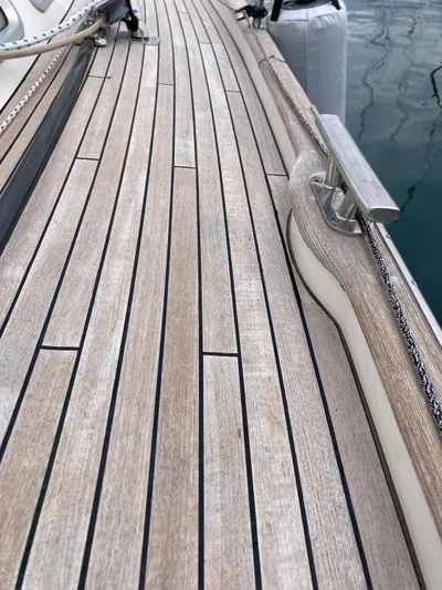 Morgan's Moon Yacht Photos Pics Teak deck of 2008 Hallberg-Rassy 43 yacht, showcasing elegant wood finish and craftsmanship.