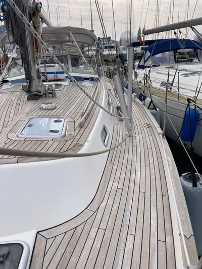 Morgan's Moon Yacht Photos Pics 2008 Hallberg-Rassy 43 sailboat with teak deck, docked in a marina.