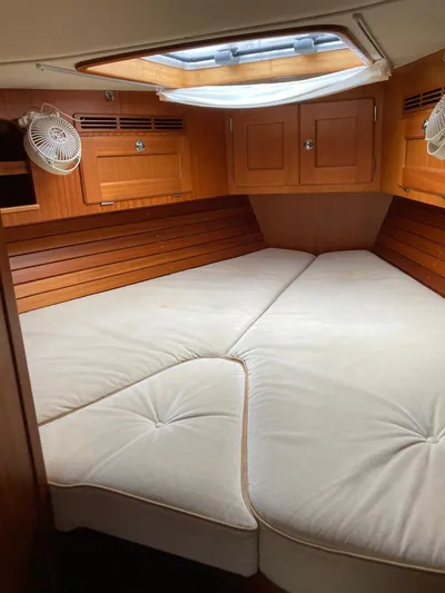 Morgan's Moon Yacht Photos Pics Cozy cabin interior of 2008 Hallberg-Rassy 43 sailboat with wooden finish and skylight.