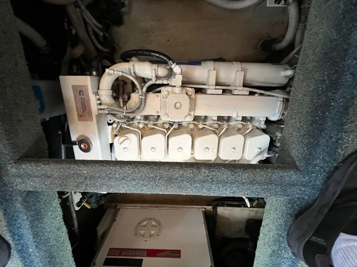 Charley's Tern Yacht Photos Pics Engine compartment of a 1998 Nordic Tug 32, featuring a Cummins marine engine.