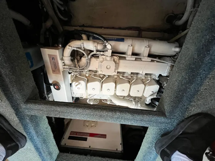 Charley's Tern Yacht Photos Pics Engine compartment of a 1998 Nordic Tug 32, featuring a Cummins marine engine.