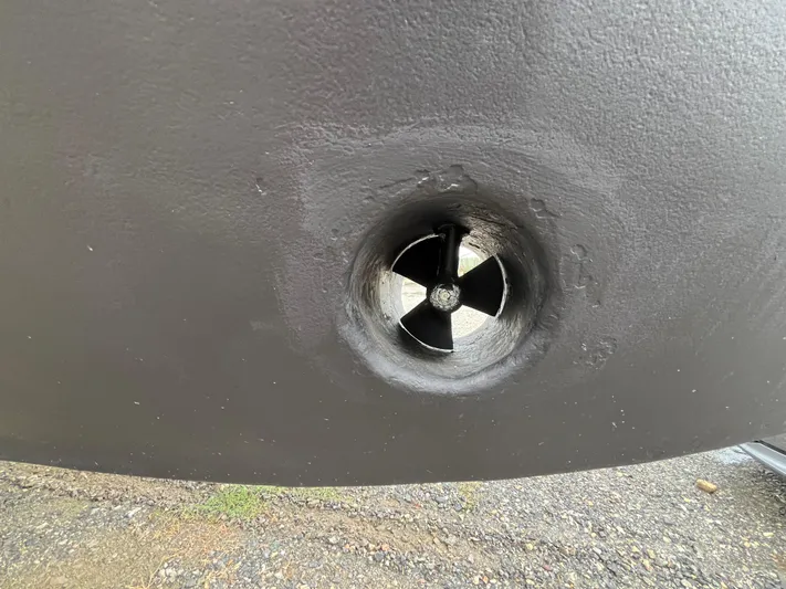 Charley's Tern Yacht Photos Pics Bow thruster of a 1998 Nordic Tug 32 boat, close-up view.