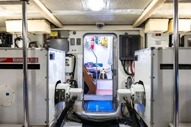  Yacht Photos Pics Engine room of 2000 Pacific Mariner 65 Motoryacht with visible equipment and control panels.