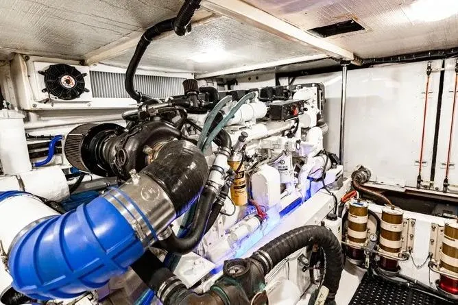  Yacht Photos Pics Engine room of 2000 Pacific Mariner 65 Motoryacht, showcasing complex machinery and components.