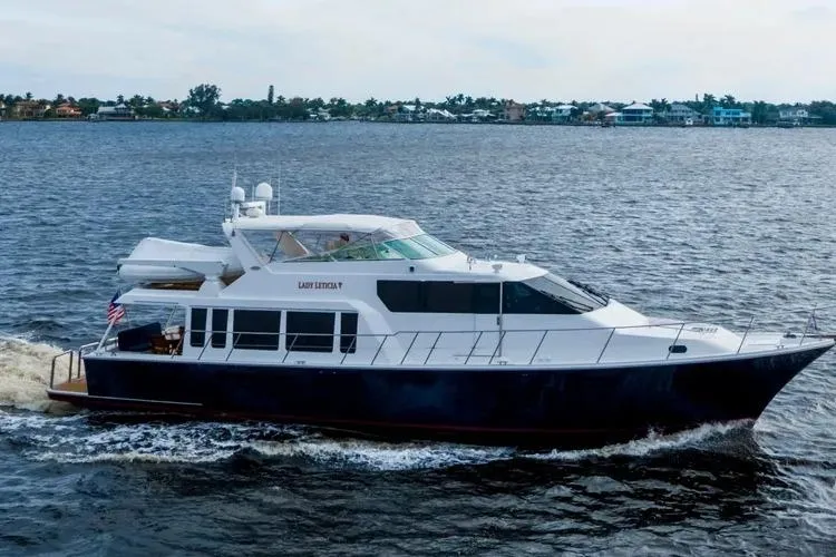  Yacht Photos Pics 2000 Pacific Mariner 65 Motoryacht cruising on open water.