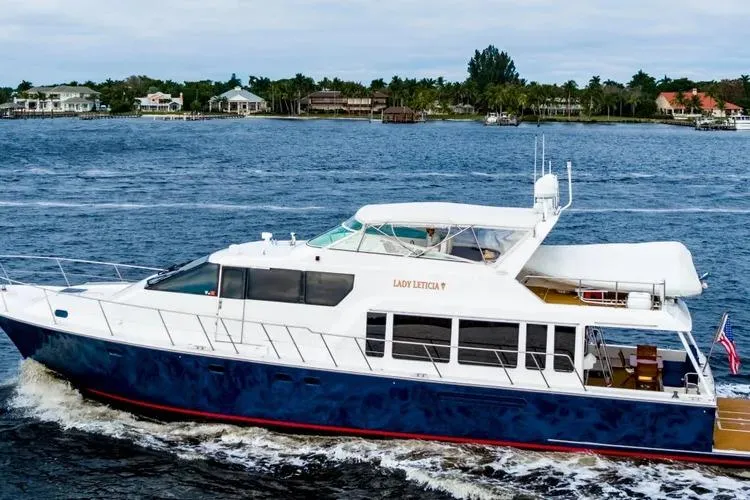  Yacht Photos Pics 2000 Pacific Mariner 65 Motoryacht cruising on a scenic waterway.