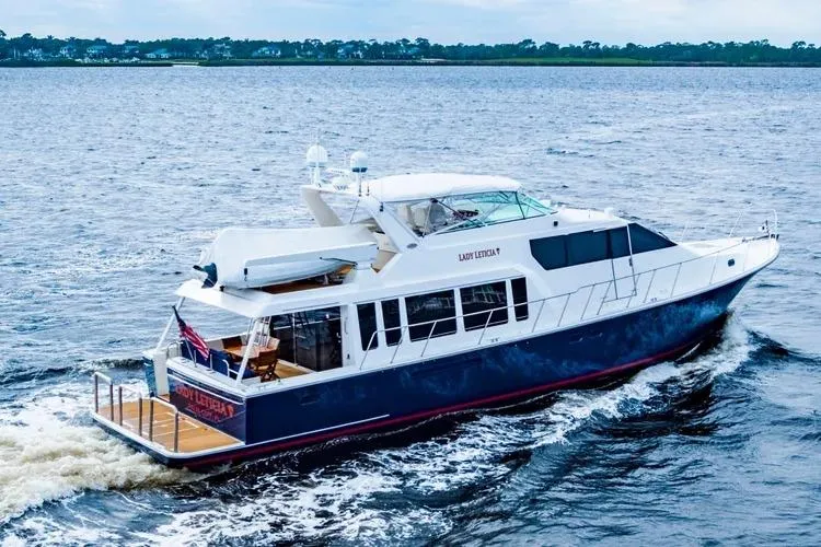  Yacht Photos Pics 2000 Pacific Mariner 65 Motoryacht cruising on open water.