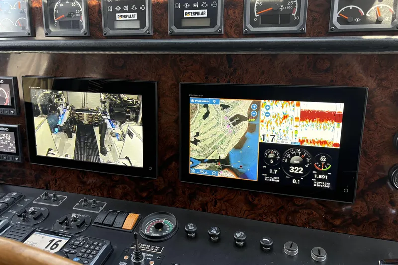  Yacht Photos Pics Control panel of a 2000 Pacific Mariner 65 Motoryacht with navigation and engine displays.