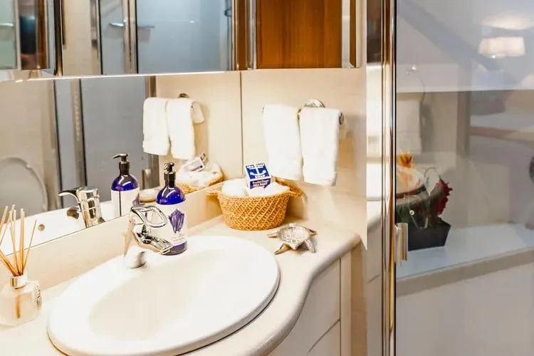  Yacht Photos Pics Luxurious bathroom in 2000 Pacific Mariner 65 Motoryacht with elegant fixtures and decor.