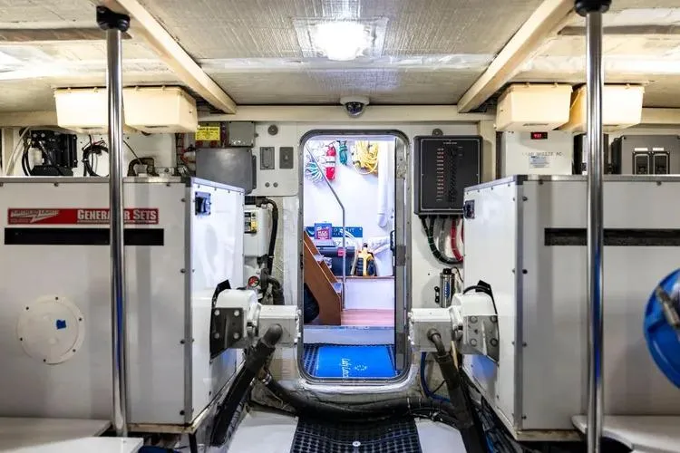  Yacht Photos Pics Engine room of 2000 Pacific Mariner 65 Motoryacht with visible equipment and control panels.