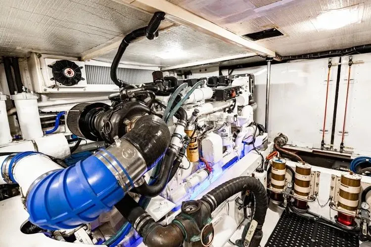  Yacht Photos Pics Engine room of a 2000 Pacific Mariner 65 Motoryacht, showcasing complex machinery and components.