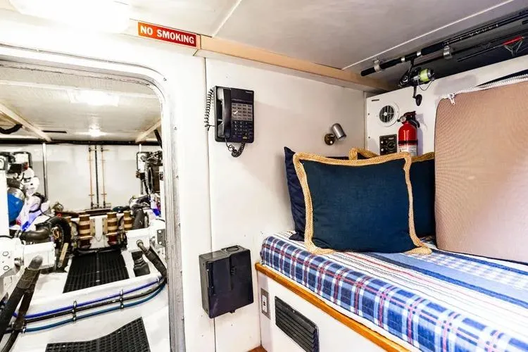  Yacht Photos Pics Interior of 2000 Pacific Mariner 65 Motoryacht with cozy bed and engine room view.