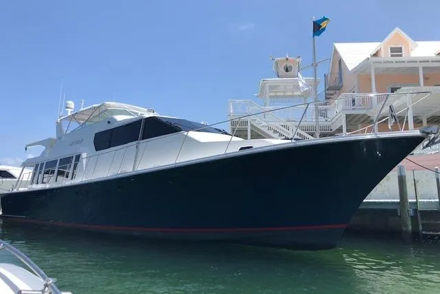  Yacht Photos Pics 2000 Pacific Mariner 65 Motoryacht docked near waterfront homes.