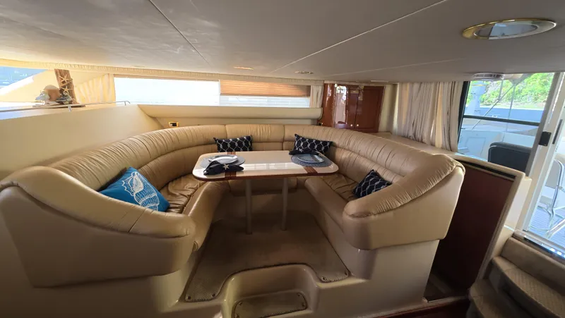 Livin' The Dream Yacht Photos Pics Luxurious interior of 2001 Sea Ray 450 Express Bridge with plush seating and elegant decor.