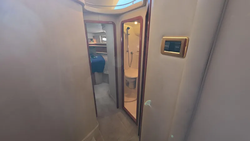 Livin' The Dream Yacht Photos Pics Interior of 2001 Sea Ray 450 Express Bridge, featuring bathroom and cabin area.