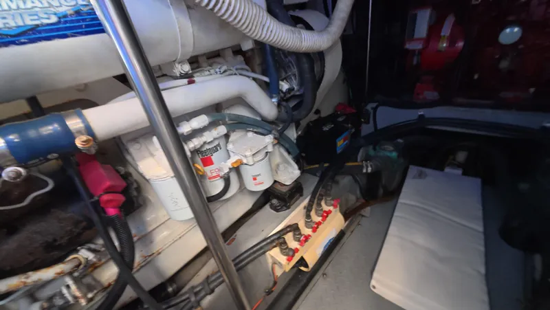 Livin' The Dream Yacht Photos Pics Engine room of a 2001 Sea Ray 450 Express Bridge, showcasing mechanical components.