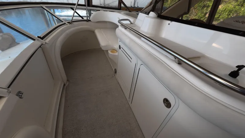 Livin' The Dream Yacht Photos Pics 2001 Sea Ray 450 Express Bridge interior with seating and storage compartments.