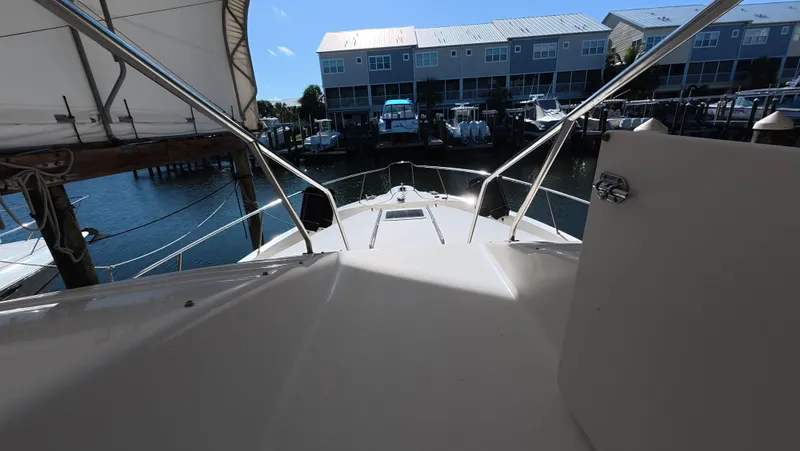 Livin' The Dream Yacht Photos Pics 2001 Sea Ray 450 Express Bridge yacht docked at marina, view from deck.