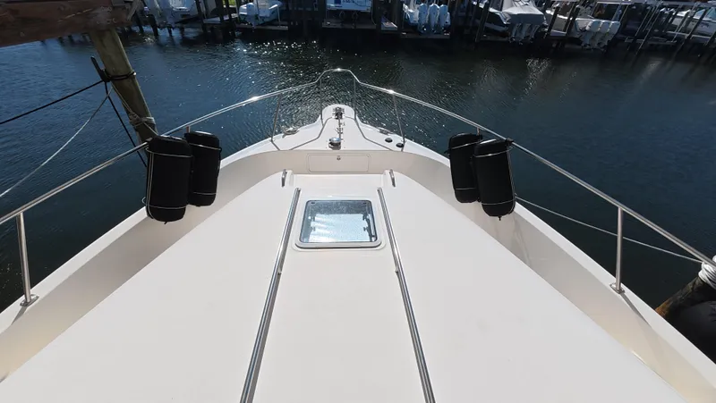 Livin' The Dream Yacht Photos Pics 2001 Sea Ray 450 Express Bridge yacht bow view at marina.