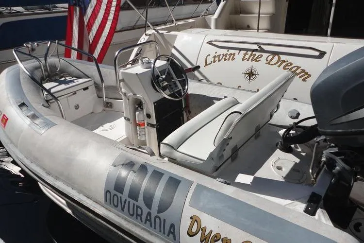 Livin' The Dream Yacht Photos Pics 2001 Sea Ray 450 Express Bridge with Novurania tender, featuring "Livin' the Dream" text.