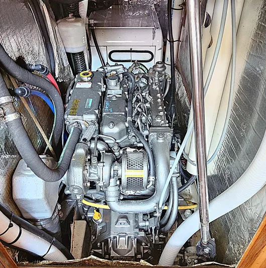  Yacht Photos Pics Engine compartment of a 2005 Hunter 456 sailboat, showcasing detailed mechanical components.