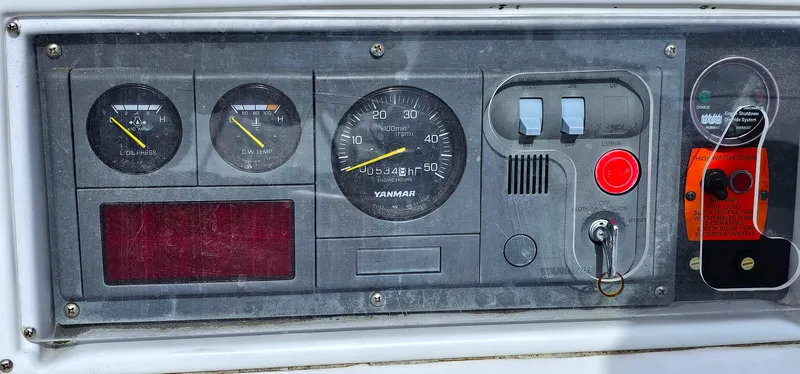  Yacht Photos Pics Control panel of a 2005 Hunter 456 boat with gauges and switches.