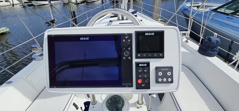  Yacht Photos Pics Sailboat cockpit with navigation system, Hunter 456, 2005 model, docked at marina.