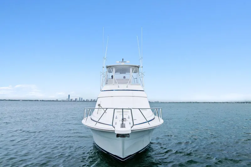 Mr. Bond Yacht Photos Pics Front view of 2006 Bertram 39 Convertible yacht on open water.