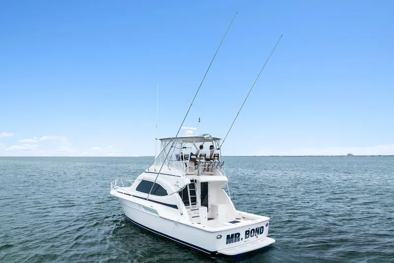 Mr. Bond Yacht Photos Pics 2006 Bertram 39 Convertible yacht on open water under clear blue sky.